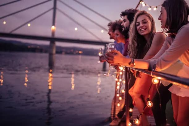 Guests enjoying the city lights from the night cruise